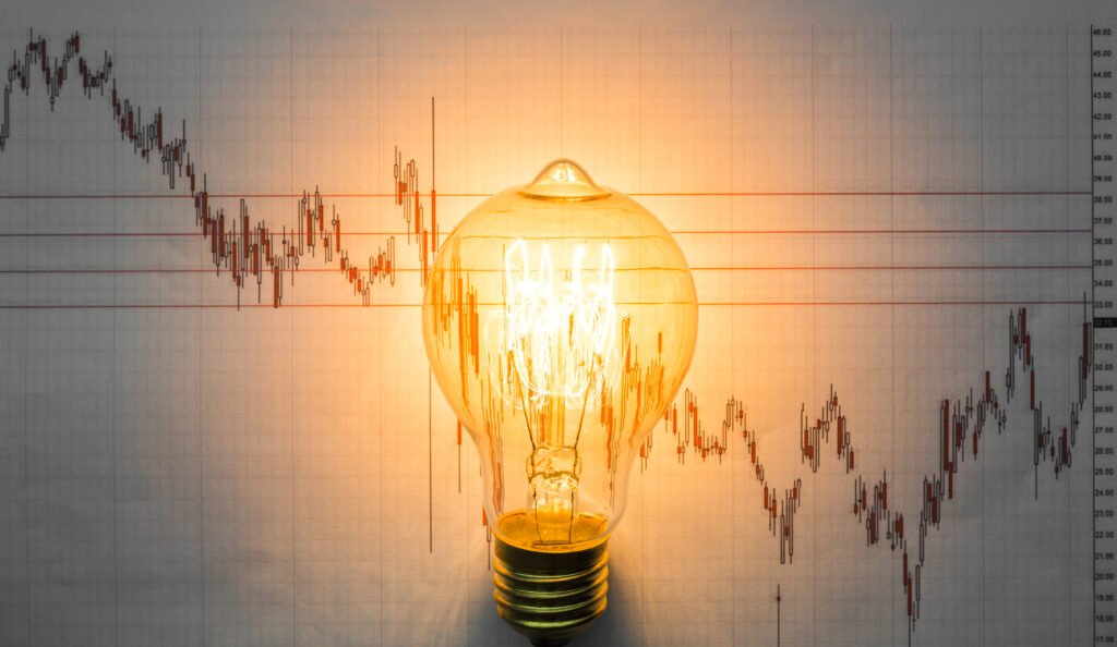 light bulb with business graph